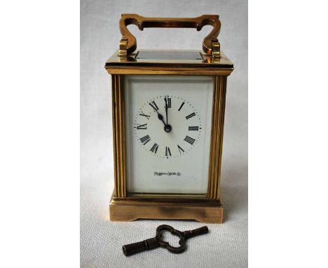 A Mappin and Webb, brass cased Carriage Clock, white enamel dial with black Roman numerals, signed Mappin and Webb Ltd., five