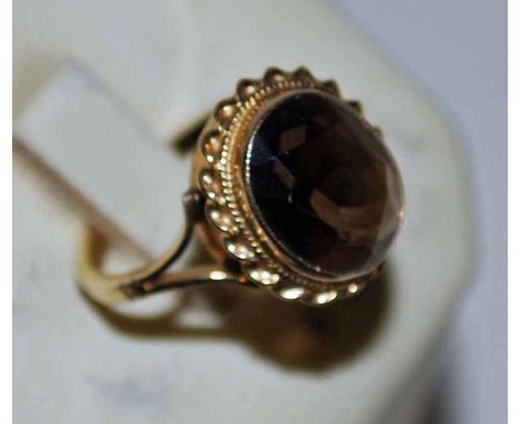 A 9ct gold smoky quartz Ring bezel set with rope twist shank on forked shoulders, Birmingham 1973, size N, 3.8g 