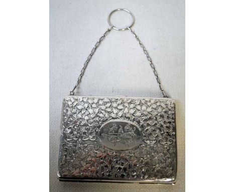 A late Victorian silver Ladies Purse of hinged rectangular form, heavily chased foliate decoration, initialled cartouche, blu