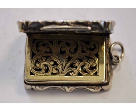 A Victorian silver Vinaigrette, shaped hinged rectangular form, scroll edges, engine turned surfaces, blank cartouche, hinged