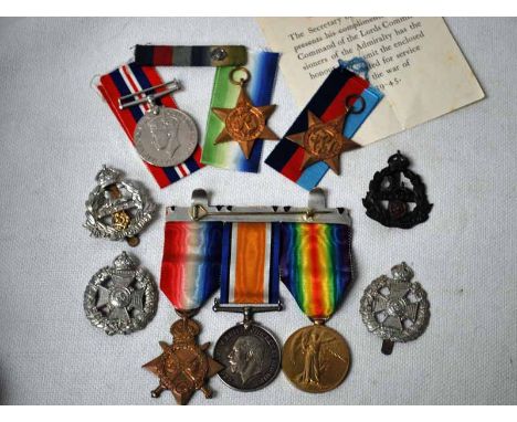 A Great War and WWII Family Group S-4018, SJT. R. Bennett, Rif. Brig. Set of three Great War medals, two Egypt Cap Badges and