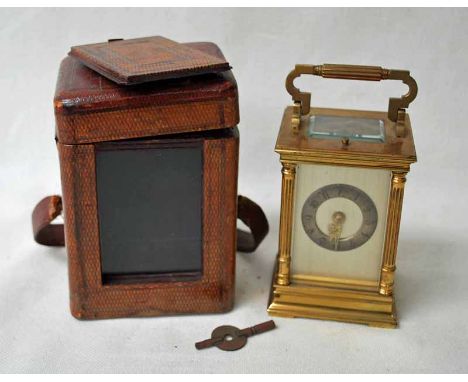A French late 19th century brass Carriage Clock, silvered face with white metal chapter ring, Arabic numerals, 2 drum repeate