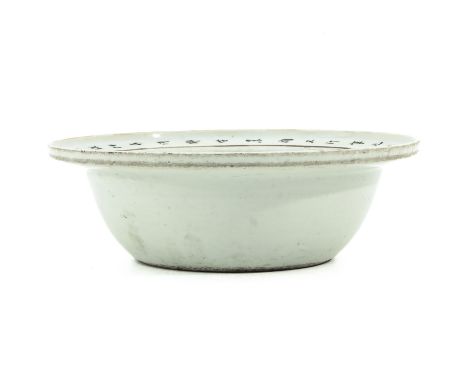 Depicting Chinese ladies in center of basin with Chinese calligraphy on rim, 26 cm. in diameter. 