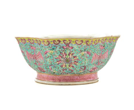 Light blue ground decorated with flowers in Famille Rose enamels, Qianlong mark, 19 cm. in diameter. 
