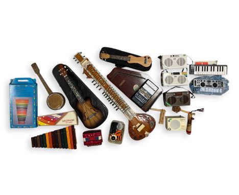 A collection of mixed musical instruments to include a Maharaja musicals sitar, a Maharaja musicals shruti box, an MP3: Eleuk