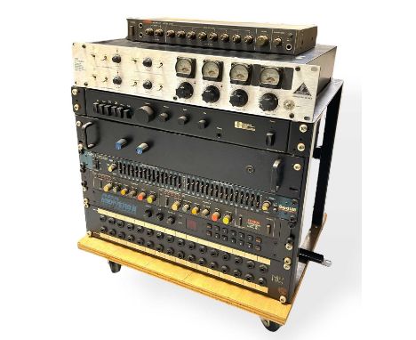 A collection of rack-mounted studio equipment, including a Beringer Tube Ultragain, a Fostex line mixer 2050, a Creek Audio C