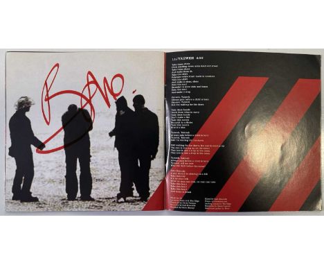 A CD booklet from U2's 'How To Dismantle an Atomic Bomb' signed to various pages by Adam Clayton, The Edge, Larry Mullen Jr, 