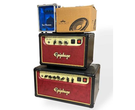 An Epiphone Valve Junior Hot Rod Amp Head, an Epiphone Valve Senior Amp Head, a SkyTronic portable guitar amp and an Eminence
