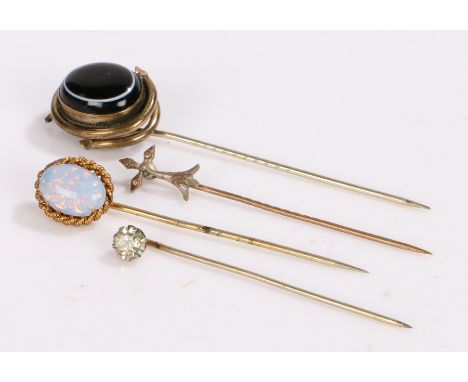 Four stick pins to include banded agate, and opal together with 2 other pins (4)  