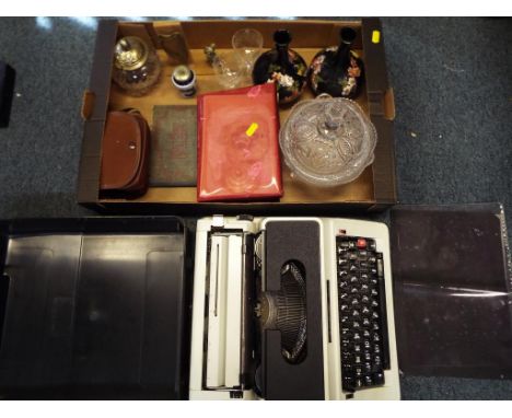 A good lot to include a vintage Silver Reed 500 typewriter in case, a vintage Kodak Brownie 127 camera, cased, a small postca
