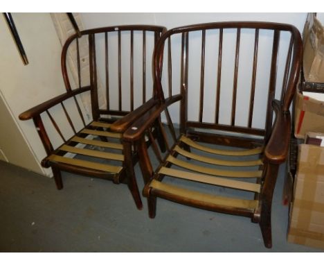 A PAIR OF DARK WOOD ERCOL FIRESIDE ARMCHAIRS, WITH STICK BACK SIDES (2) 