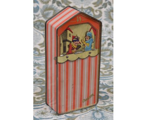 Advertising - a Cremona novelty tin in the form of a Punch and Judy outfit, the faux tent tin printed with orange and white v
