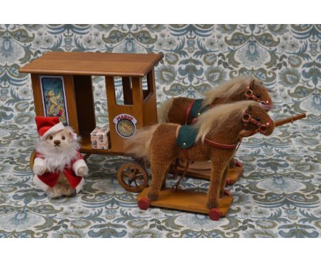 Steiff (Germany) EAN 037986 Santa's Express set, comprising Santa Claus teddy bear with wooden carriage being led by a pair o