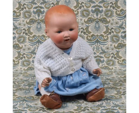 An Armand &amp; Marseille (Germany) bisque head and painted composition bodied 'Dream' baby doll, the bisque head with weight