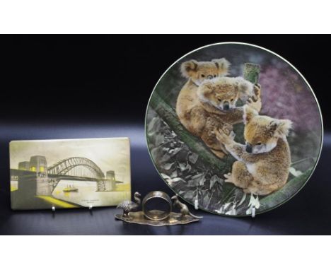 Silver plate Kangaroo and Emu napkin ring together with a Royal Doulton Koala display plate and a Sydney Harbour bridge wall 