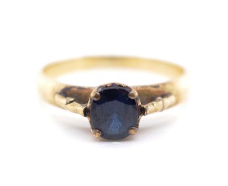 Blue gemstone and gold ring marked 18k, gem tests as a spinel. Approx weight 2.7 grams, ring size N. Tests as 10ct