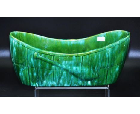 John Campbell Australian pottery canoe trough vase green glaze, raised paddle decoration to sides,  inscribed to base, 30cm w