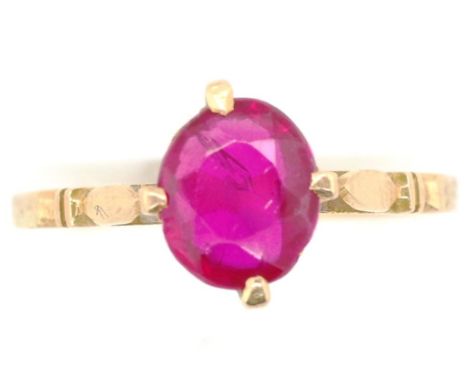 Red gemstone and 18ct yellow gold ring marked with Egyptian 18ct marks. Approx weight, 1.8 grams, ring size M. Stone as inspe