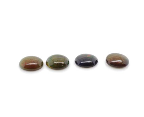 Four loose black opal cabochons