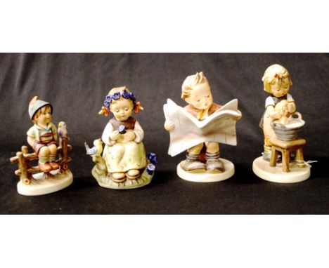 Four various Goebel Hummel figurines including Girl bathing baby, 13cm high (tallest) approx.