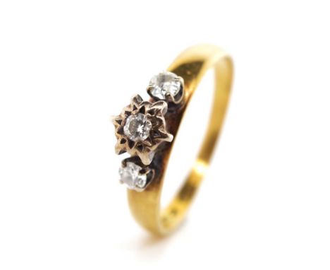 Three stone diamond 18ct gold ring with a raised palladium setting Marked 18ct Pall. Approx weight 3.2 grams, ring size P-Q