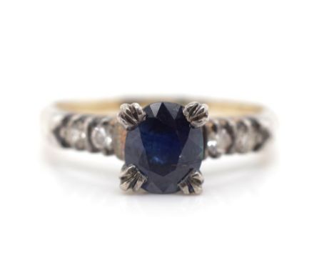 Sapphire and diamond set gold ring in a unmarked handmade setting tests as 9ct . Approx 2.39 grams, ring size L