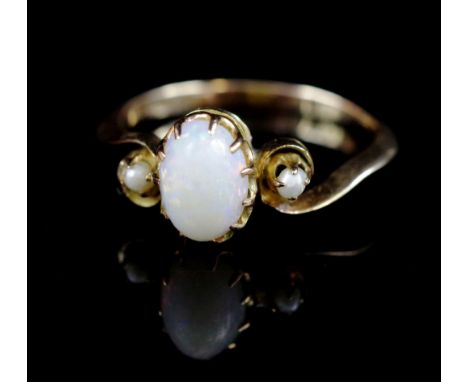 Edwardian opal and rose gold ring with a handmade raised prong setting, pierced work gallery and tapered shank, set with thre