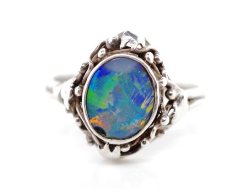 Australian Art &amp; Crafts opal doublet ring in the Wager manner. Unmarked. Approx ring size, ring size O. A/F to doublet