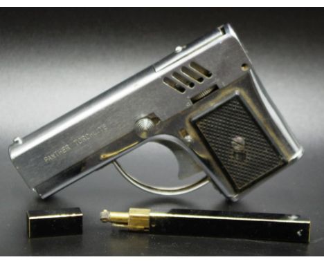 Vintage novelty lighter in the form of a gun together with a slim line black enamel lighter