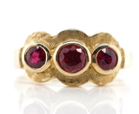 Ruby set 9ct rose gold trilogy ring marked 375. Approx weight 3.4 grams, ring size L-M