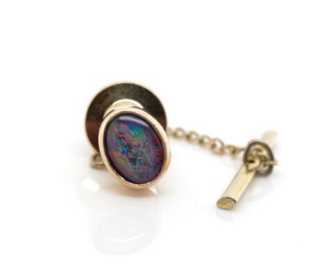 9ct rose gold and opal triplet tie tack marked 9ct. to tack not the fitting  Approx weight 1.19 grams