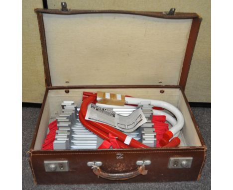 An escape ladder, in brown leather suitcase