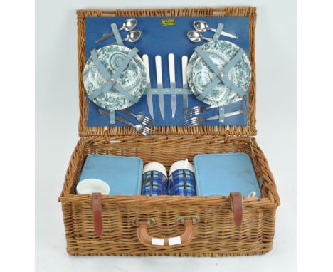 A retro wicker picnic hamper by Brexton, for four people