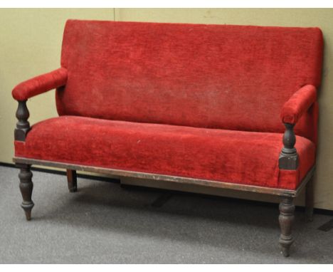 A Victorian mahogany two seat sofa upholstered in red, 133cm wide