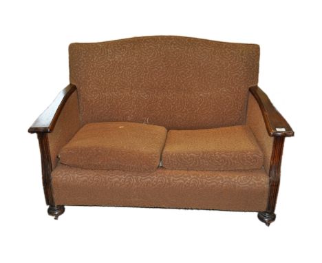 A two seater sofa with oak frame, 126cm wide (sold as a collector's item only)