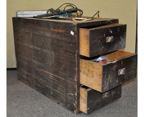 A three drawer chest with tools