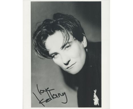 K D Lang signed 10x8inch black and white photo. Good condition. All autographs are genuine hand signed and come with a Certif