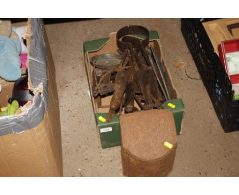 A box containing various sheep shearers, balance scales, etc.  
