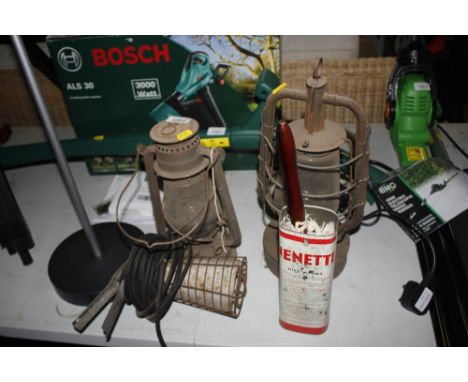 Two hurricane lamps; an inspection lamp etc.