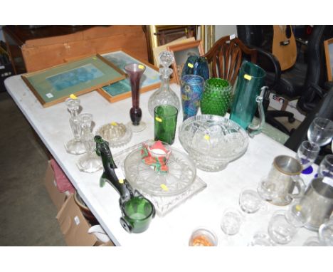 A quantity of glassware to include green glass horse and chariot; candle sticks; glass bowl; dressing table items; decanter a