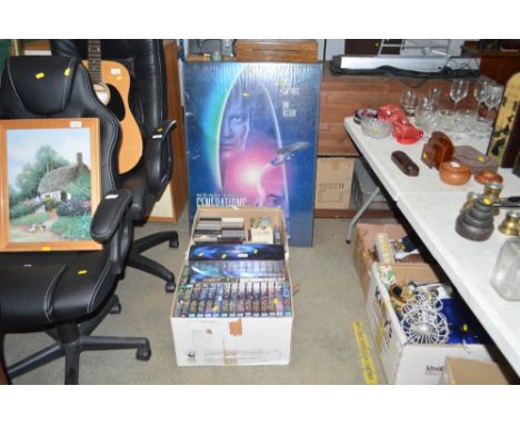 A quantity of Star trek VHS tapes, a large print etc
