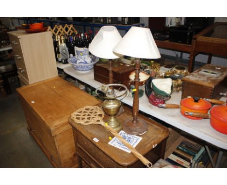 A pair of turned table lamps and shades; an oil lamp converted to electricity; rug beater etc