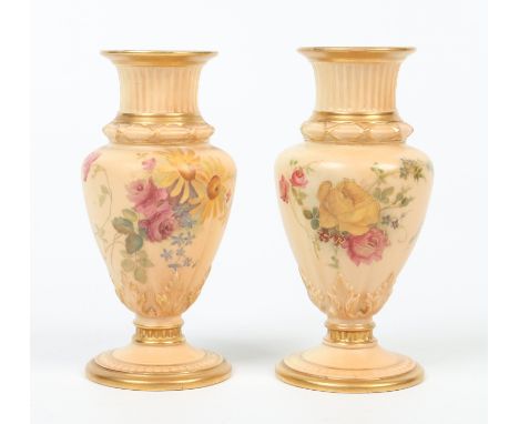 A pair of small Royal Worcester blush ware centre pedestal specimen vases. With ribbed moulding to the necks and decorated wi