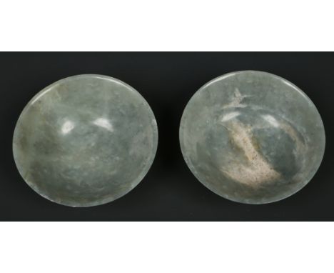 A pair of Chinese mutton fat jade turned conical bowls, 10cm diameter. Condition Report. To be used as a guide only. Good con