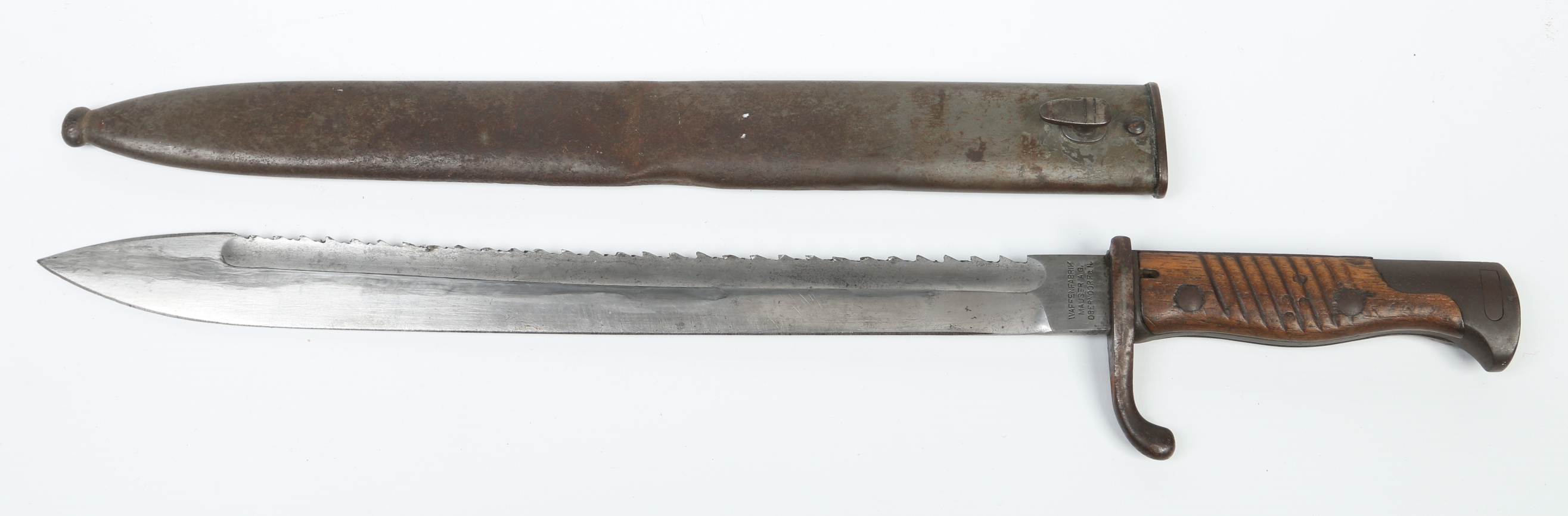 A German World War I serrated bayonet in metal scabbard. Waffenfabrik 