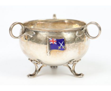 An Edwardian planished silver sugar bowl by Ramsden & Carr (Omar Ramsden & Alwyn Carr). With three wirework loop handles and 