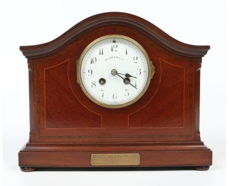An Edwardian inlaid mahogany cased dome topped mantel clock. Housing an eight day Japy Freres cylinder movement striking half