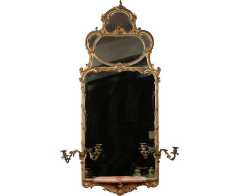 A 19th century giltwood and gesso pier mirror. With shaped multi glass pediment and having four ormolu scrolling candle sconc