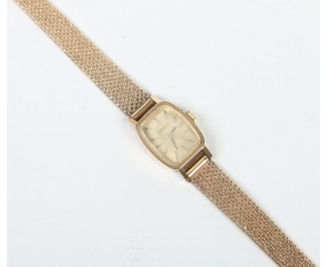 A ladies 9 carat gold vintage Tissot manual bracelet watch. With rectangular dial and having baton markers. 24 grams, 15mm wi