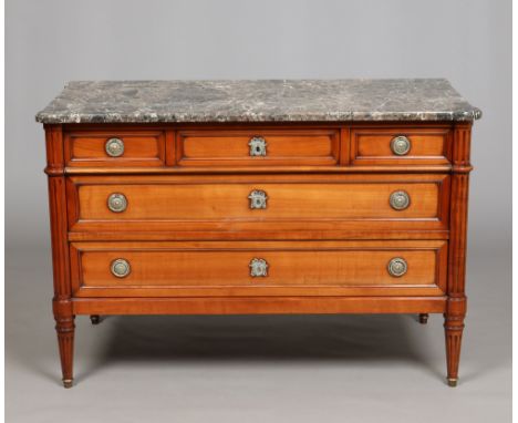 A 20th century French marble topped walnut commode chest raised on reeded toupie feet, 128cm wide. Condition Report. To be us